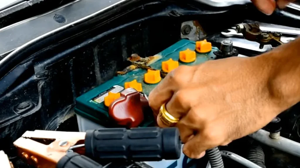Checking car battery and electrical connections to fix a BMW Check Engine Light