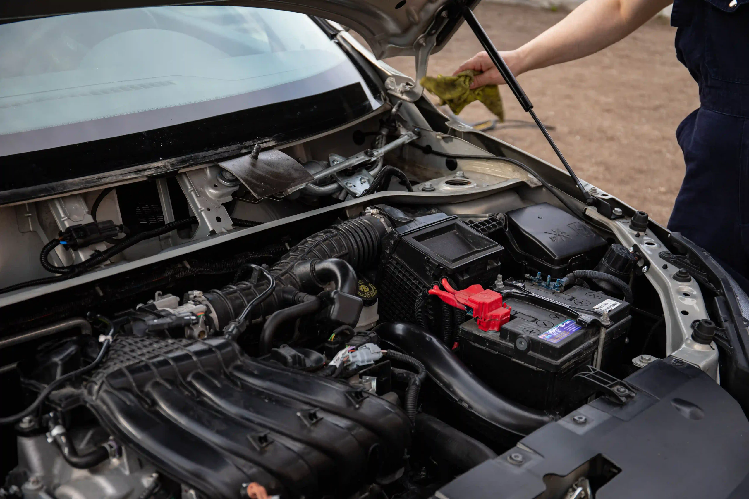 Professional technician diagnosing a BMW in an auto repair shop
