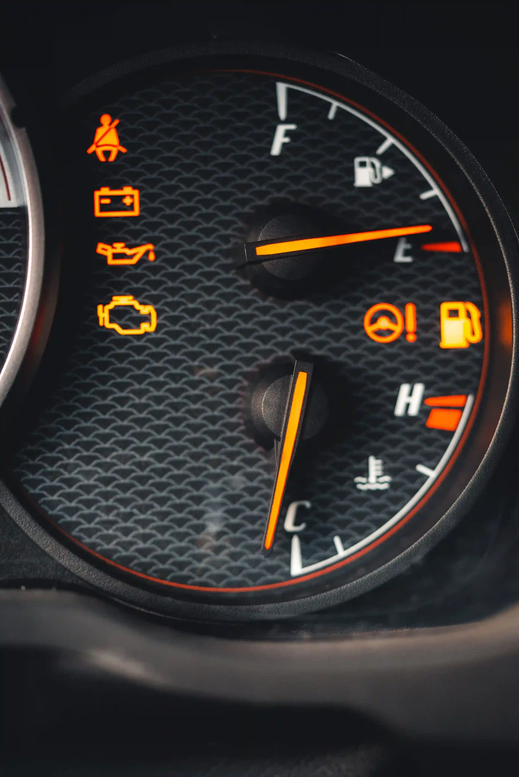 Solid and flashing check engine light warning on car dashboard