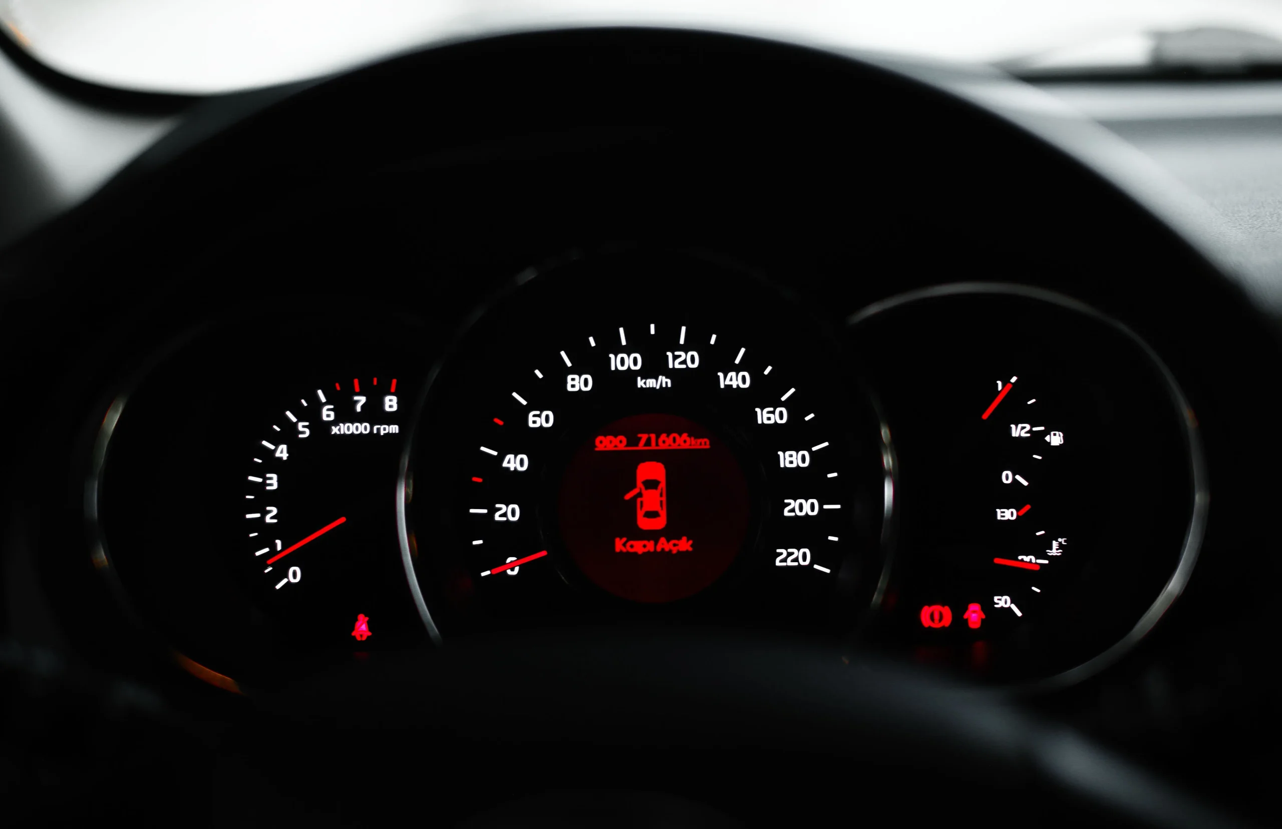 What does the check engine light mean on a car dashboard