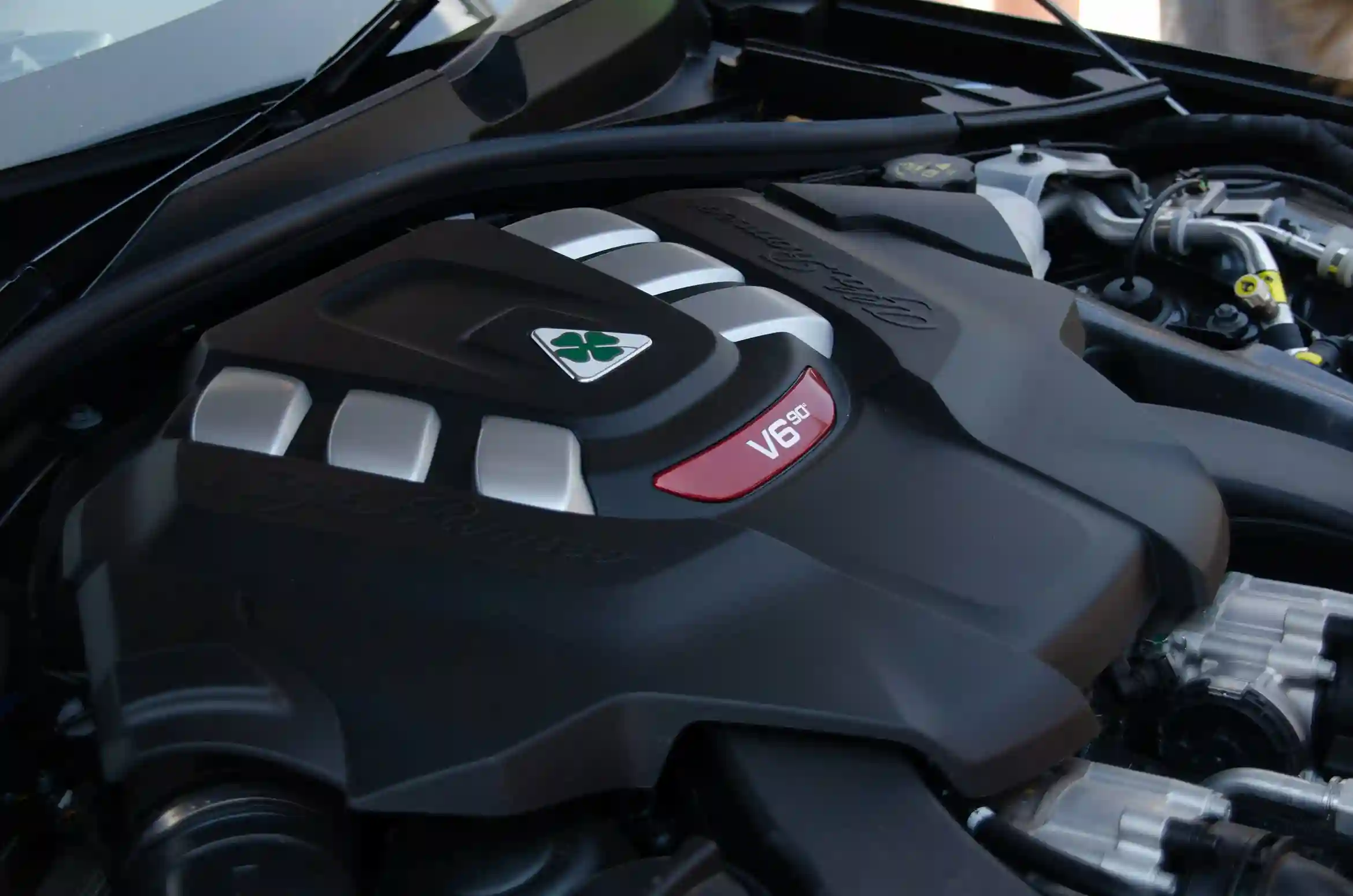 Car engine being inspected for mechanical problems