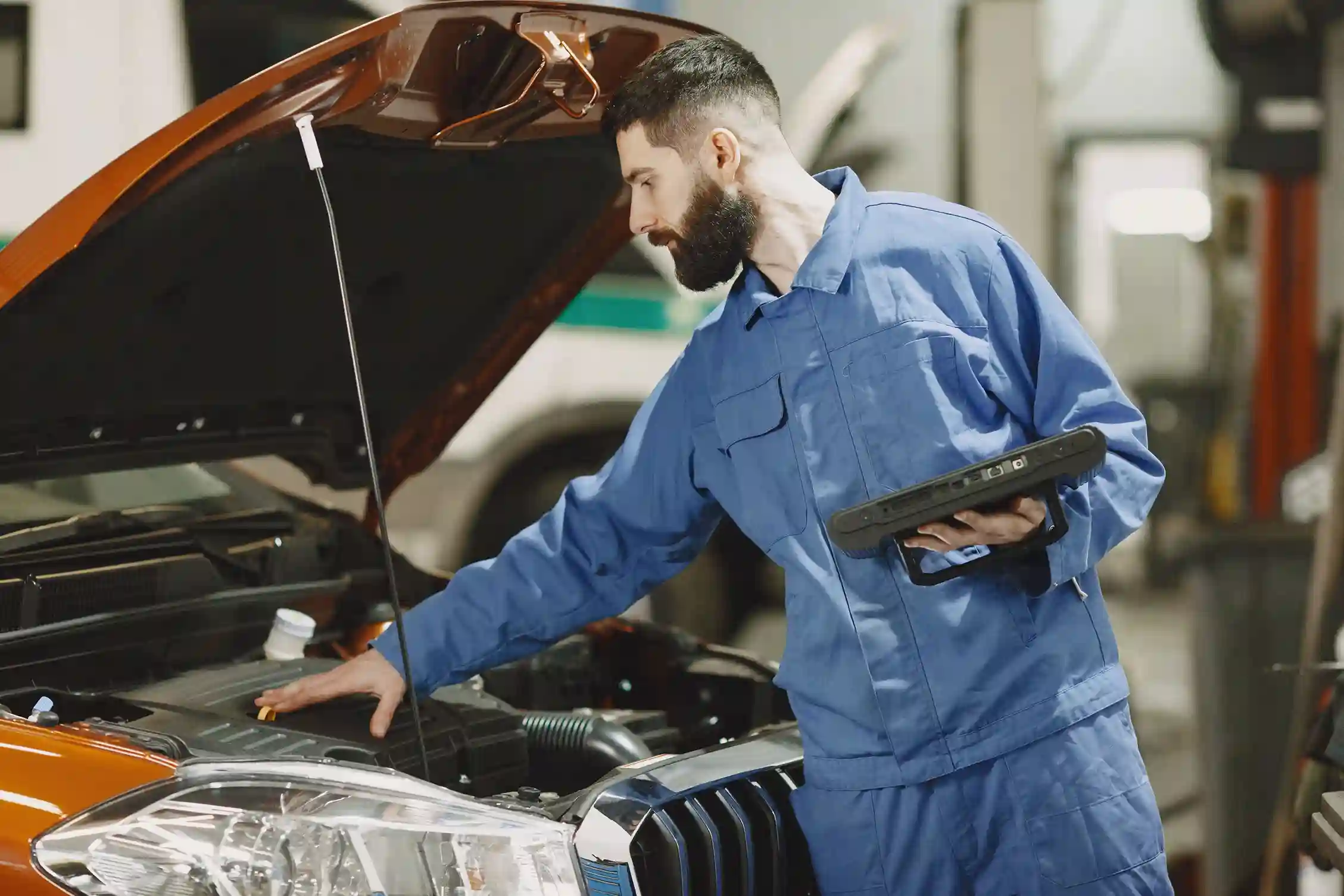 Mechanic replacing an oil filter during vehicle maintenance