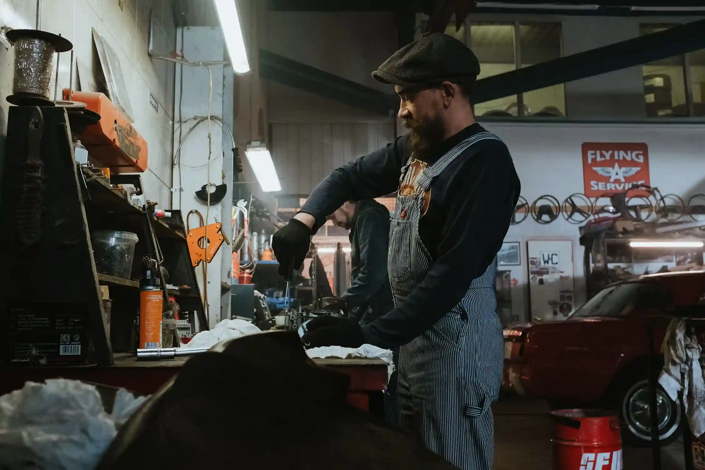 Automotive technician inspecting a vehicle before transmission repair